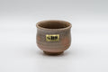 Japanese Teacup - Hagi-yaki Yunomi by Hagiden Kiln - 90ml - front view of the Hagi-yaki yunomi with the kiln label, showing the crazed peach gohonte glaze