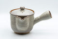 Japanese Kyusu - 萩焼 Houhin-style Hagi-yaki Do-ake Teapot - 450ml - three-quarter front view of the cream-glazed Hagi-yaki teapot with side handle and wide spout