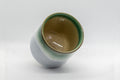 Tezumi — Japanese Teacup - Agano-yaki - Green Tsutsu-gata Yunomi - 180ml — tipped to show the interior