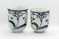 Japanese Teacups - Pair of Floral Tsutsu-gata Yunomi - 150ml - front view of the pair of teacups with blue floral design