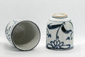 Japanese Teacups - Pair of Floral Tsutsu-gata Yunomi - 150ml - one cup on its side showing the interior beside an upright cup