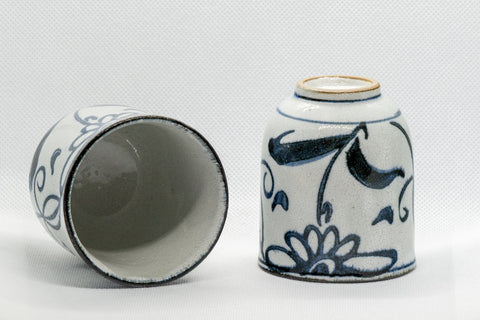 Japanese Teacups - Pair of Floral Tsutsu-gata Yunomi - 150ml - one cup on its side showing the interior beside an upright cup