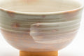 Tezumi — Nishio Kashu Shigaraki-yaki gohonte chawan, wide side view showing the wan-nari form and pink glaze
