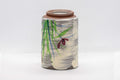 Tezumi — Japanese Teacup - Brushed white glaze tsutsu-gata yunomi with floral design - 150ml — closeup of the foot