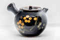 Japanese Kyusu - Tenmoku Maru-gata Arita-yaki Teapot - 400ml - three-quarter front view showing the black tenmoku glaze and orange plum blossom motifs