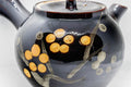 Japanese Kyusu - Tenmoku Maru-gata Arita-yaki Teapot - 400ml - closeup of the body showing the orange plum blossom decoration