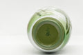 Japanese Teacups - Meoto Pair of Green Floral Yunomi - one teacup tilted to show the interior and footring