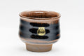 Japanese Teacup - 丹彩 Tenmoku Glazed Guinomi - 65ml - angled view showing the ribbed body and tenmoku glaze