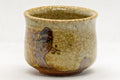 Japanese Teacup - Green Glazed Stoneware Guinomi - 30ml - closeup of the crazed green glaze with crawling revealing the brown stoneware