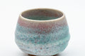 Japanese Teacup - Turquoise Obori Soma-yaki Guinomi - front view showing the pink lip flowing into turquoise