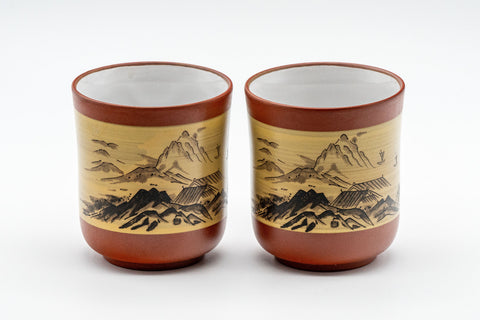 Japanese Teacup Pair - Two Tokoname-yaki yunomi - 125ml - the pair of red Tokoname-yaki cups side by side, front view showing the mountain landscape scene