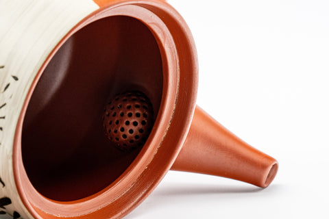 Japanese Kyusu - Tokoname-yaki Teapot with Bamboo Scene - 300ml - closeup of the half-spherical ceramic debeso filter inside the pot