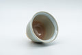 Japanese Teacups - 天鵬山 Tsubaki Kiln - Pair of Beige Glazed Hagi-yaki Yunomi - 85ml - one teacup resting on its side showing the interior