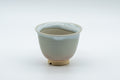 Japanese Teacups - 天鵬山 Tsubaki Kiln - Pair of Beige Glazed Hagi-yaki Yunomi - 85ml - angled view of a single teacup