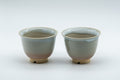 Japanese Teacups - 天鵬山 Tsubaki Kiln - Pair of Beige Glazed Hagi-yaki Yunomi - 85ml - the pair shown side by side at a slight angle