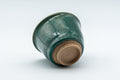 Japanese Teacup - Green Yuteki Glazed Koishiwara-yaki Yunomi - 90ml - three-quarter view tilted to show the footring