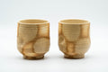Japanese Teacups - Pair of Giraffe Tsutsu-gata Yunomi - 140ml - front view of the pair of mottled beige cylindrical cups