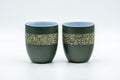 Japanese Teacups - Pair of Green Ryokudei Tokoname-yaki Yunomi - 130ml - front view of both cups showing the mottled yellow glaze band over green clay