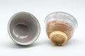 Japanese Teacups - Pair of 天鵬山 Tsubaki Kiln - White Glazed Hagi-yaki Yunomi - 120ml - one teacup tilted to show the interior beside one showing the footring