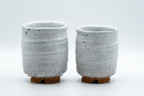 Japanese Teacups - Pair of Shino Glazed Stoneware Tsutsu-gata Meoto Yunomi - front view of the pair of white shino-glazed cups