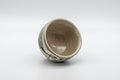 Japanese Teacup - Leafy Grey Yunomi - 125ml - the cup tipped to show the crazed beige interior