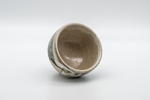 Japanese Teacup - Leafy Grey Yunomi - 125ml - the cup tipped to show the crazed beige interior