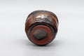 Japanese Pottery - Hand-formed Yunomi Teacup - 55ml - closeup showing the irregular brown-black glaze