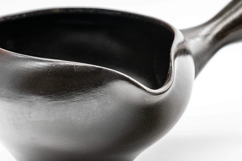 Tezumi — Japanese Yuzamashi - 哲生作 Black Kokudei Yōhen Tokoname-yaki Water Cooler - 230ml — tipped to show the interior