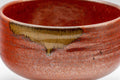 Japanese Matcha Bowl Set - Tanaka Kayama Ochre Glazed Hantsutsu-gata Chawan with Bamboo Chasen Whisk and Chashaku Scoop - 450ml - closeup of the exterior showing the mottled red glaze with ochre drip