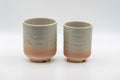 Tezumi — Japanese Teacups - Couple's Pair of Tsutsu-gata Hagi-yaki Meoto Yunomi — three-quarter view