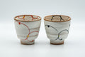Japanese Teacups - Pair of Brush Glazed Hasami-yaki Yunomi - 170ml - front view of the pair showing the orange and blue brushed designs