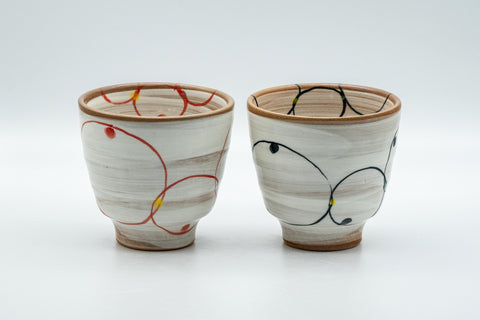 Japanese Teacups - Pair of Brush Glazed Hasami-yaki Yunomi - 170ml - front view of the pair showing the orange and blue brushed designs