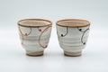 Japanese Teacups - Pair of Brush Glazed Hasami-yaki Yunomi - 170ml - three-quarter view of the pair of teacups