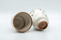 Japanese Teacups - Pair of Brush Glazed Hasami-yaki Yunomi - 170ml - the two cups resting on their sides showing the footrings