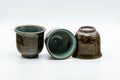 Japanese Teacups - Set of 3 Olive Green Turquoise Koishiwara-yaki Yunomi - 100ml - the three teacups arranged with one resting on its side