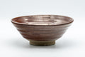 Japanese Matcha Bowl - Red Spiraling Hira-gata Summer Chawan - 300ml - angled front view of the flat rust-red spiraling bowl