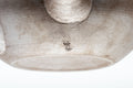 Tezumi — closeup of the engraved kanji on the grey Banko-yaki clay body