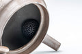 Tezumi — Kanji-engraved Banko-yaki kyusu teapot with the lid removed, revealing the perforated ceramic debeso filter