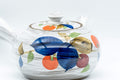 Tezumi — Floral brush-glazed kyusu teapot seen from above, showing the lid and painted decoration