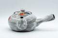 Tezumi — Floral brush-glazed kyusu teapot, front view showing the spout and painted fruit