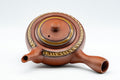 Japanese Tea Set - Tokoname-yaki Debeso Kyusu with 3 Yunomi - overhead view of the decorated teapot lid