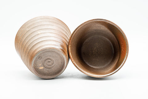 Japanese Teacups - Pair of Ido-gata Shigaraki-yaki Yunomi - 175ml - angled view of the pair with one cup tilted to show the interior