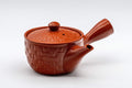 Japanese Kyusu - Tokoname-yaki Teapot with Mesh Filter - 200ml - three-quarter view of the red Tokoname-yaki side-handle teapot with its basket-textured surface, lid on