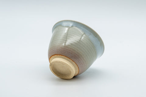 Japanese Teacups - 天鵬山 Tsubaki Kiln - Pair of Beige Glazed Hagi-yaki Yunomi - 85ml - one teacup tilted on its side showing the unglazed foot