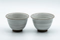 Japanese Teacups - Pair of White Glazed Yunomi with Long Grass Motifs - 100ml - front view showing the painted long grass motifs
