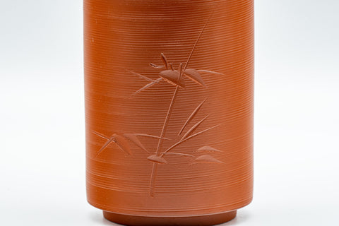 Japanese Teacups - Pair of Bamboo Tokoname-yaki Meoto Yunomi - three-quarter view of one cup showing the engraved bamboo design