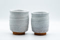 Japanese Teacups - Pair of Shino Glazed Stoneware Tsutsu-gata Meoto Yunomi - front view of the two tsutsu-gata yunomi