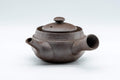 Tezumi — Kanji-engraved Banko-yaki debeso kyusu teapot, side view of the grey unglazed clay teapot with side handle