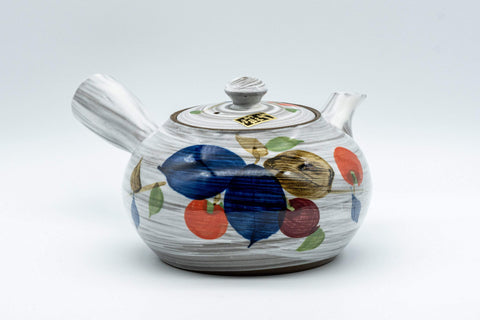 Tezumi — Floral brush-glazed debeso kyusu teapot, side view with the side handle and painted fruit decoration
