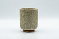 Japanese Teacup - Milky Green Koishiwara-yaki Yunomi - 180ml - front view of the cylindrical cup showing its textured milky green glaze